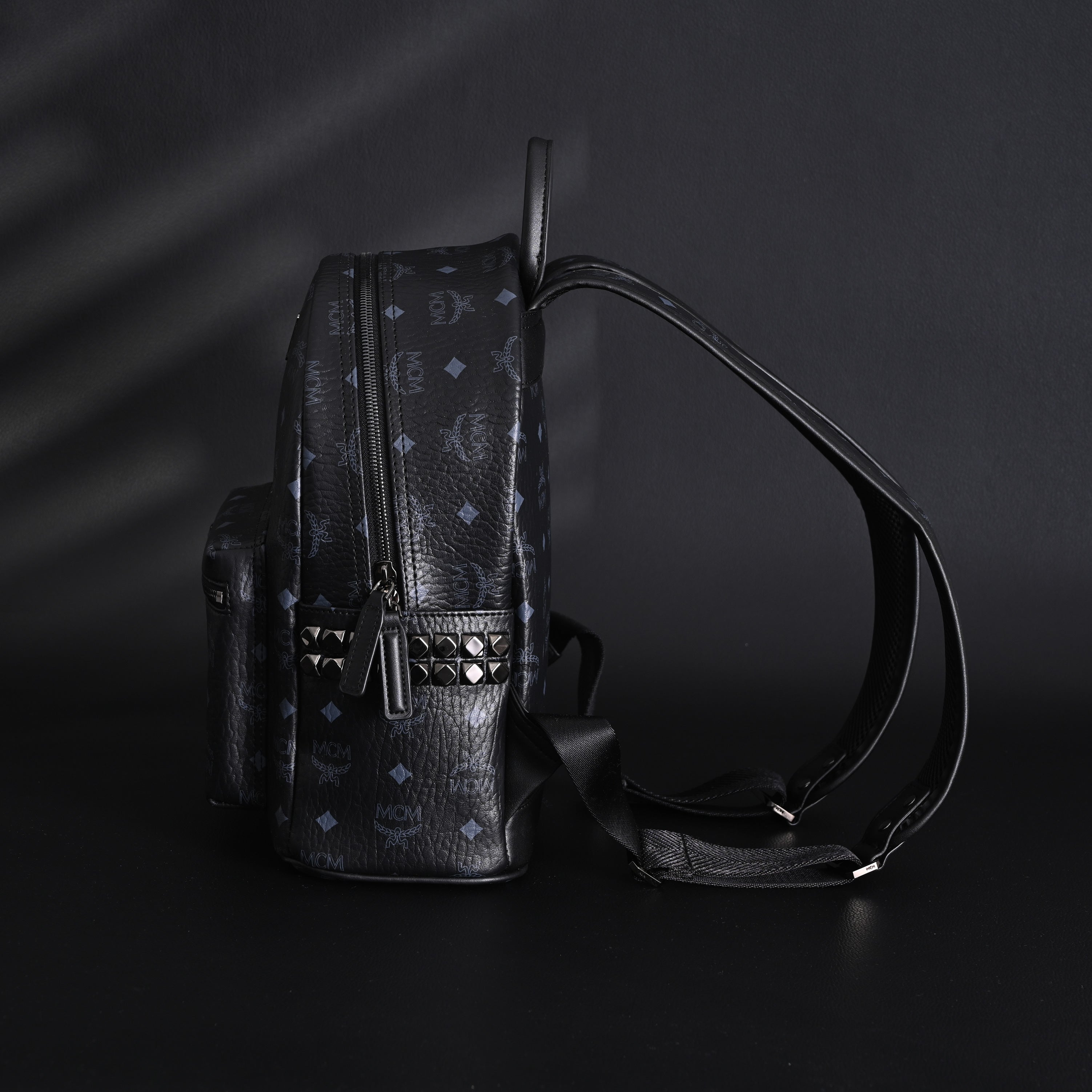 MCM Stark Visetos Medium Backpack – Black Monogram with Studded Detailing